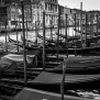 venice-italy-venezia-italia-gondola-boat-canal-docks-black-white-by-nick-saglimbeni